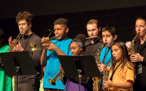 sondio students with faculty playing brass and woodwinds in the MLK day performance