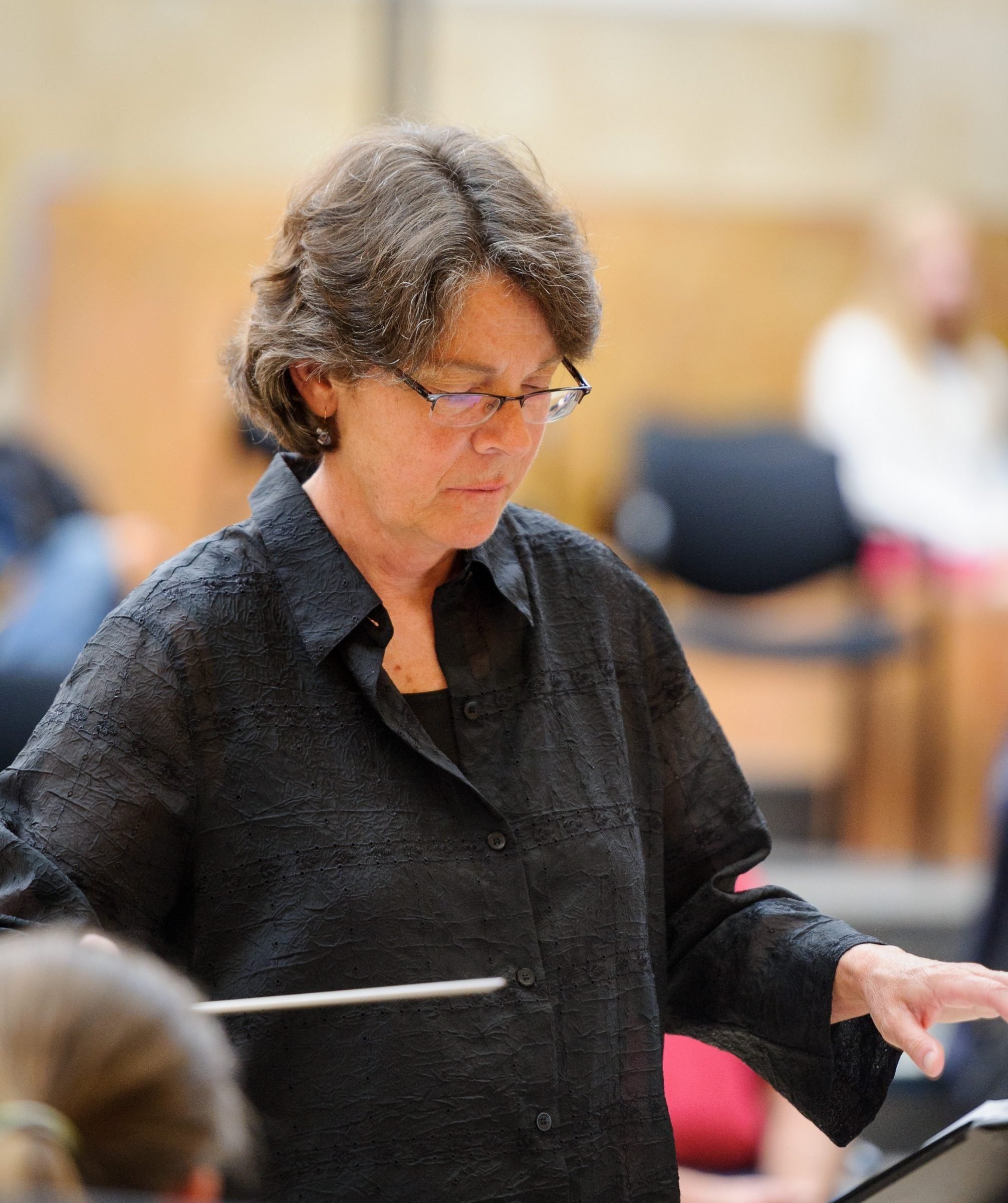 Marty Knieriem conducting with a blurred background