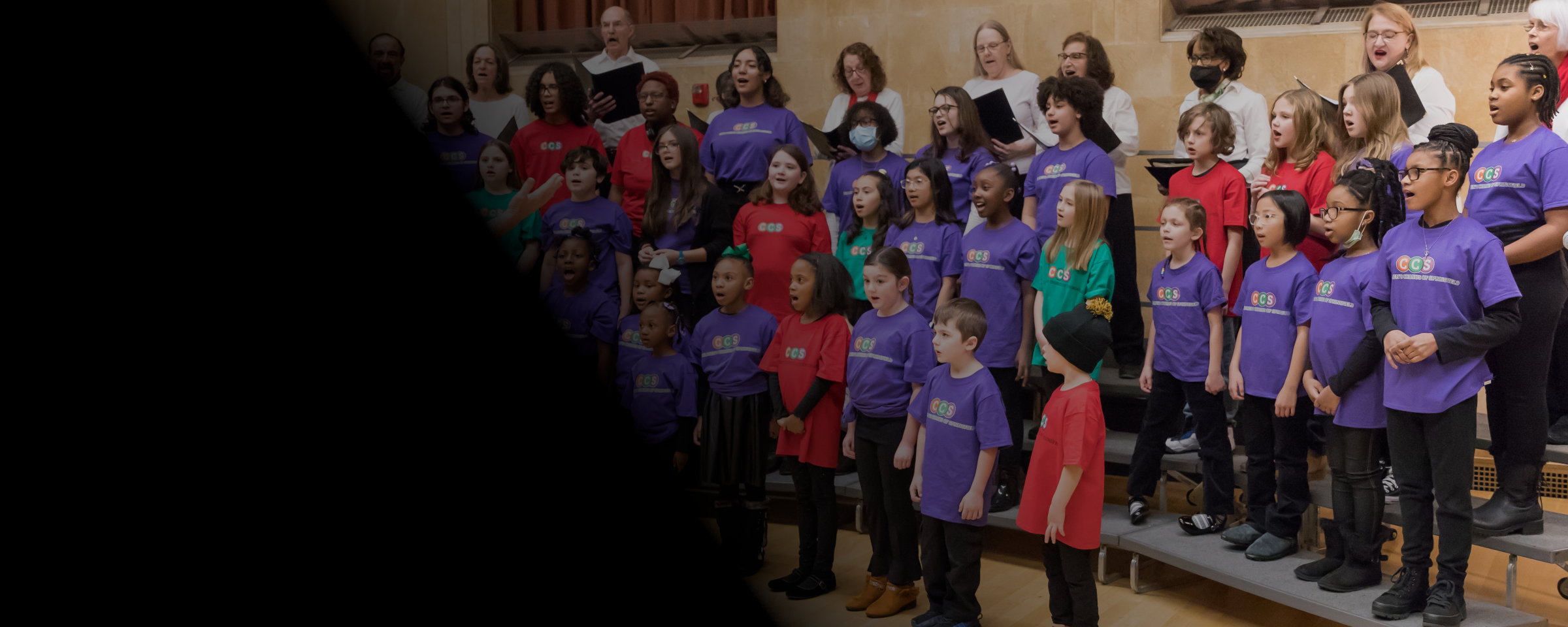 Young students singing in colorful t-shirts
