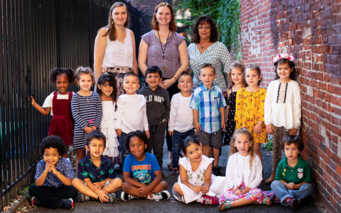 Class prelude preschool class, students in front and teachers behind