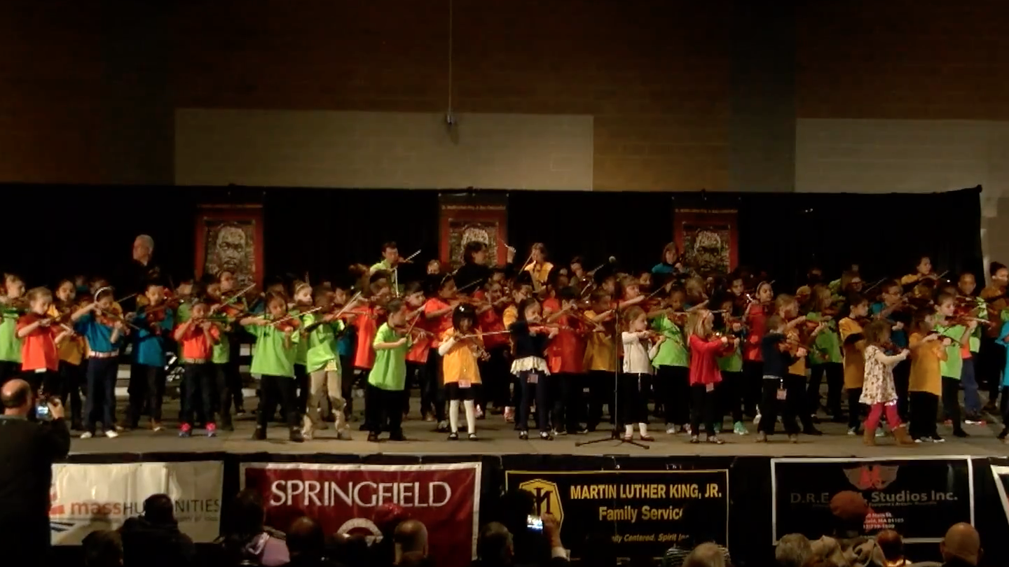 Sonido string students playing on stage at the MLK Day performance