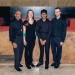 The percussion section of YWES posing after their winter concert in Robyn Newhouse Hall