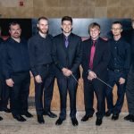 YWES faculty and ringers posing after their winter concert in Robyn Newhouse Hall