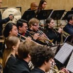 The trumpet, percussion and french horn section playing in the YWES winter concert