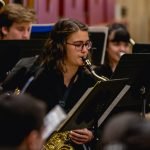 Close up of a saxophone member of YWES playing in the winter concert