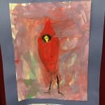 Prelude preschool art piece, a painting of a red cardinal with a blue paper border