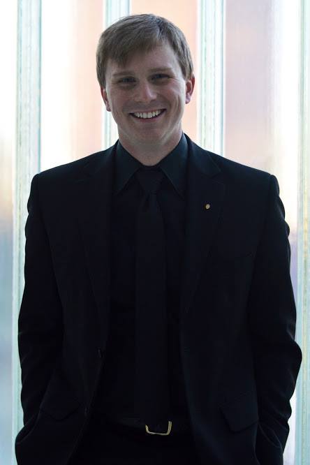 Dave Morris standing and smiling